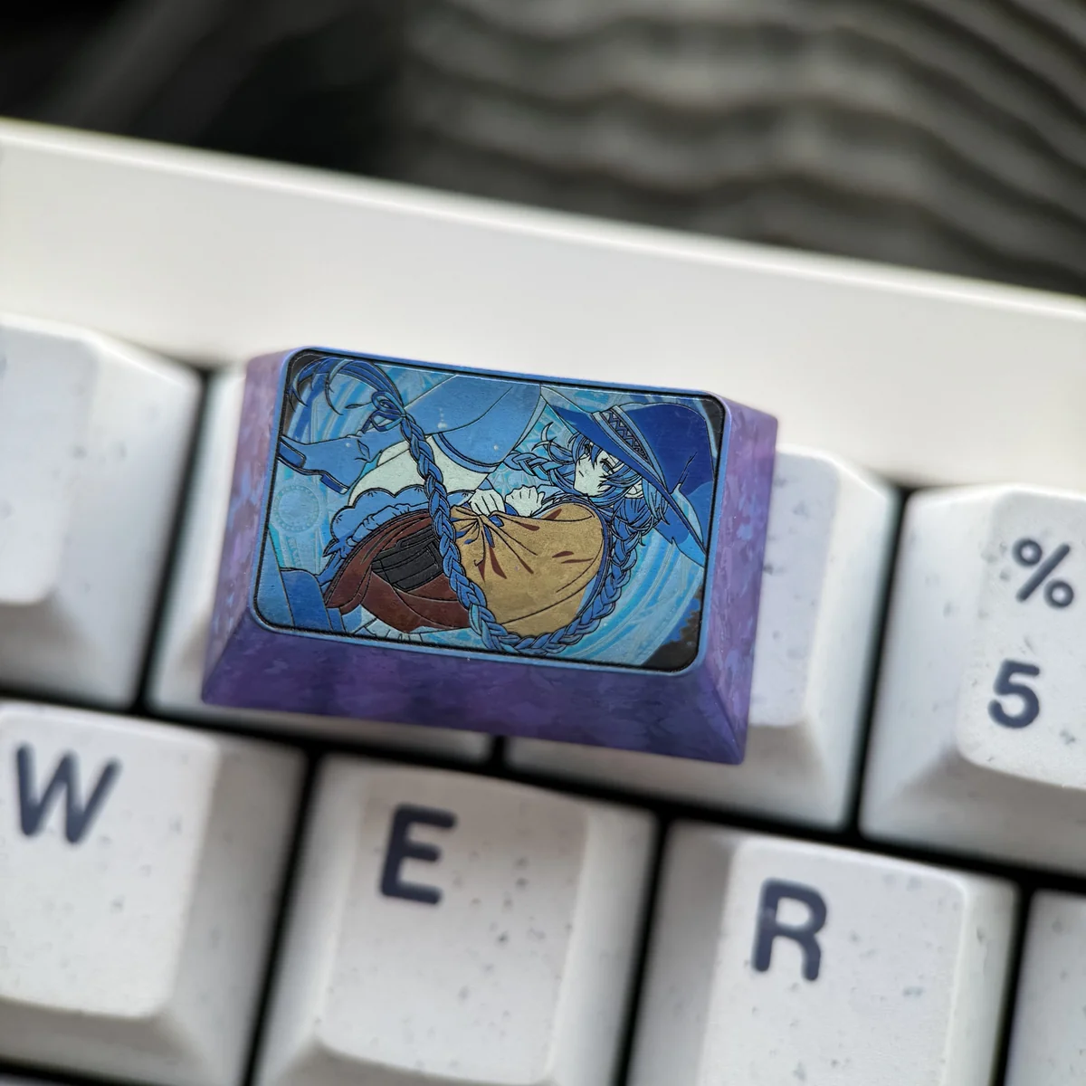 Mushoku Tensei fan merchandise: a premium titanium Roxy Migurdia custom keyboard cap on display.