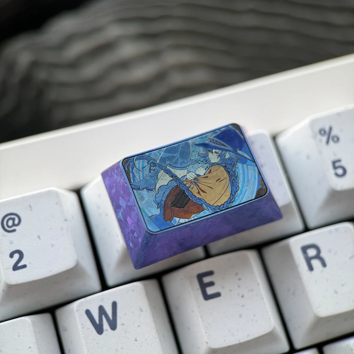 Various angles of the exclusive Roxy Migurdia anime collectible keyboard cap, showcasing quality and design.