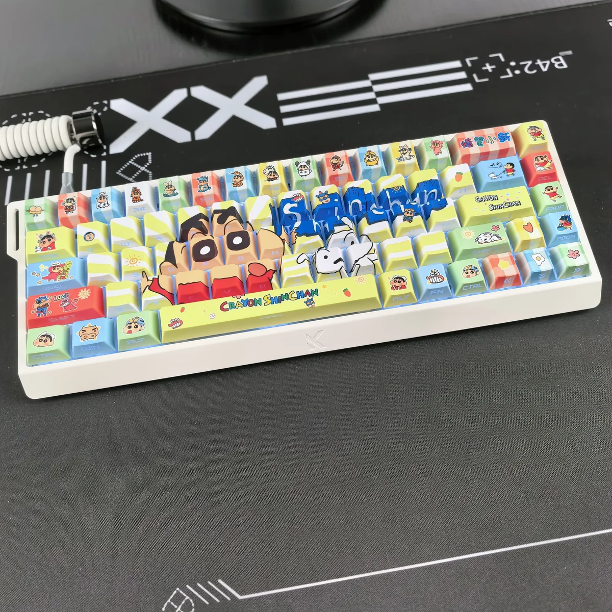 Shin-chan side-print PBT keycaps set from multiple angles. Features vibrant, iconic characters and glowing backlit legends for a playful keyboard.