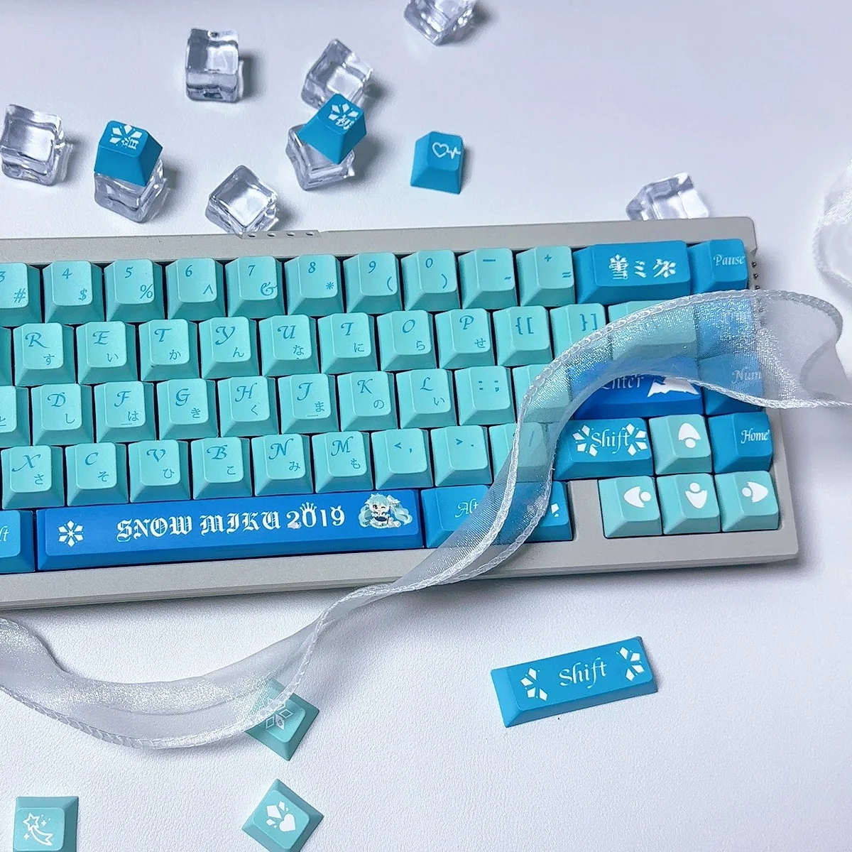 Exclusive Snow Hatsune Miku PBT Dye-Sub keycaps Set gallery. Features character art and snowflakes in icy blue, white, and purple, capturing the winter dream.
