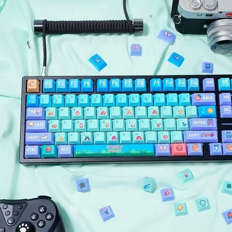 Stardew Valley PBT Dye-Sub Keycap Set, featuring vibrant pixel art and charming farm elements for an immersive artistic experience.