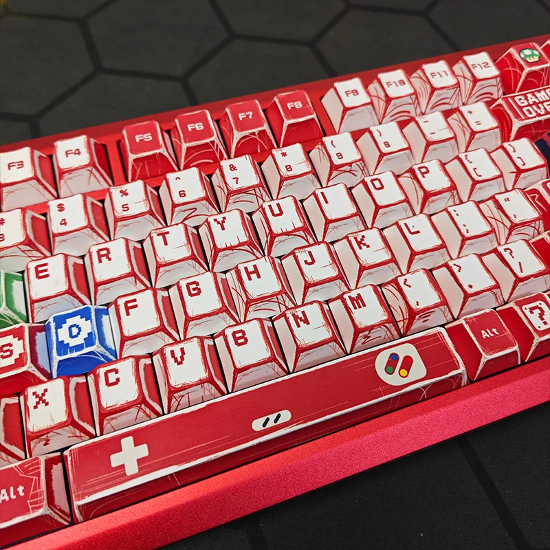 Vibrant Super Mario Family Computer PBT dye-sub keycaps set featuring iconic 8-bit characters and console elements from various playful angles.