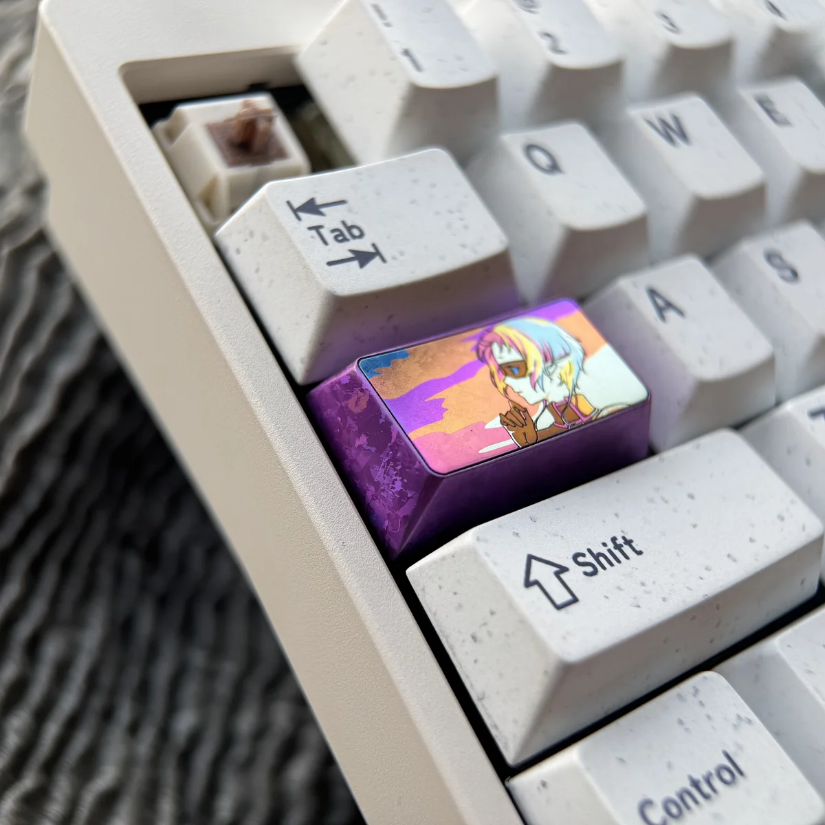 Vibrant Sylphiette anime artisan keycap crafted from premium polished titanium, captured from a unique angle to highlight its intricate character design.
