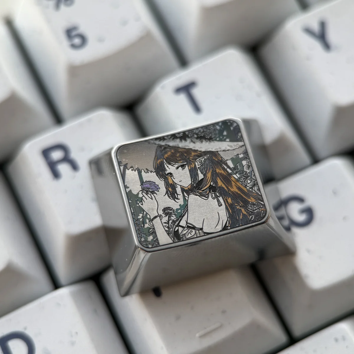 Cartethyia precision engraved titanium keycap. Gallery views highlight aerospace-grade material, intricate metallic patterns, and futuristic artistry.
