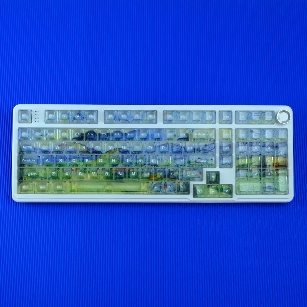 Van Gogh Misty Translucent PC Keycaps Set glowing with diffused, dreamlike backlighting, showcasing artistic Van Gogh-inspired designs on frosted keycaps.