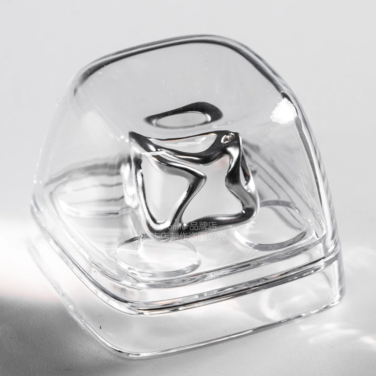 Handcrafted Venom keycap gallery, showcasing its dark alloy details encased in transparent resin from various angles, embodying an edgy villain aesthetics.