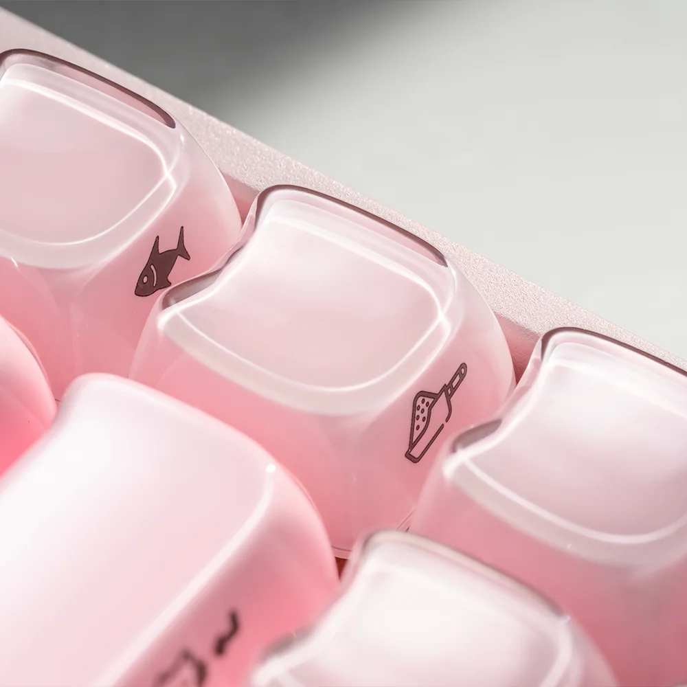 Collection of individual Whimsical Crystal Jelly MAO Keycap Set, showing their translucent material, detailed feline shapes, and smooth finish from various angles.