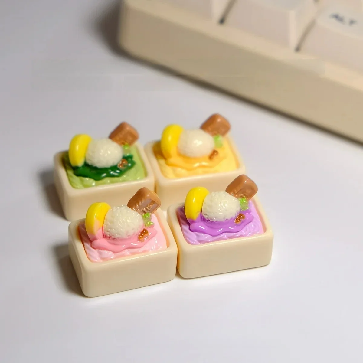 Whimsical handcrafted ice cream keycap from multiple angles, showcasing its realistic miniature scoops and vibrant pastel colors.