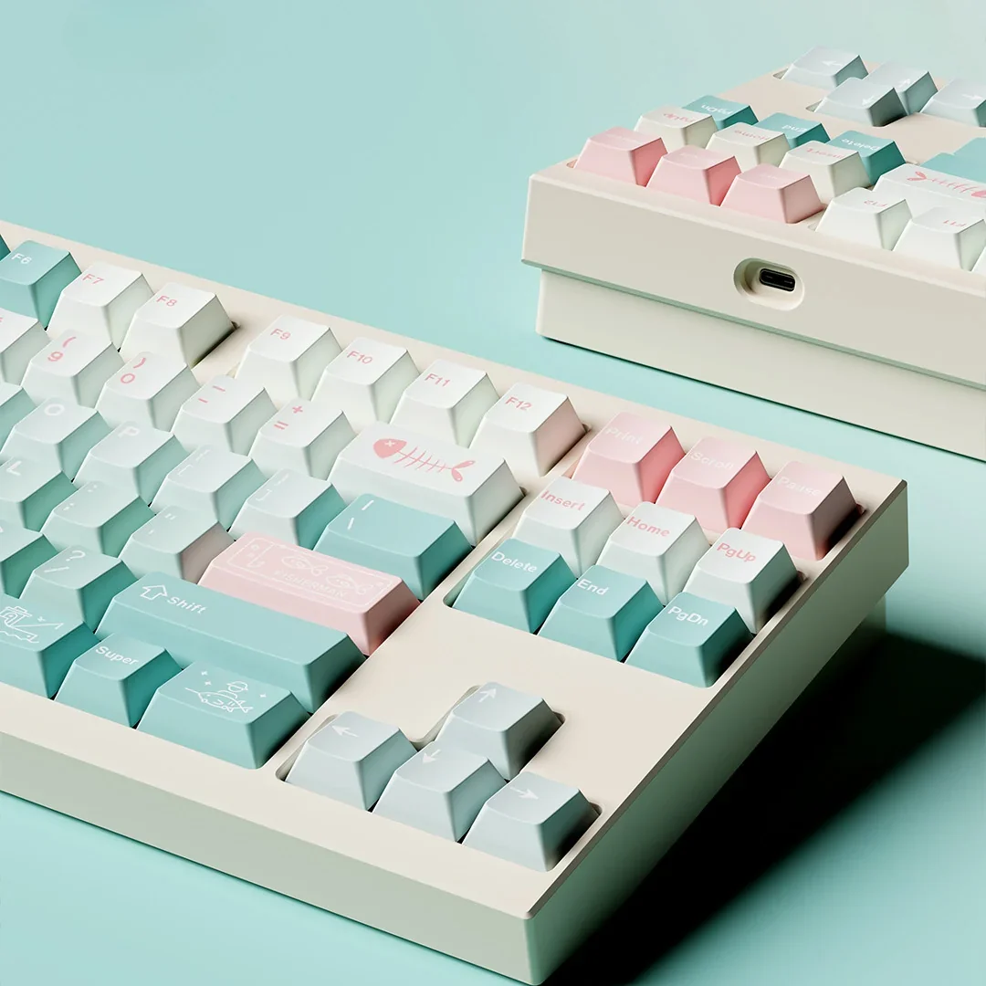 Overhead view of Winter Angler PBT keycaps, showcasing the full themed layout and serene color palette.