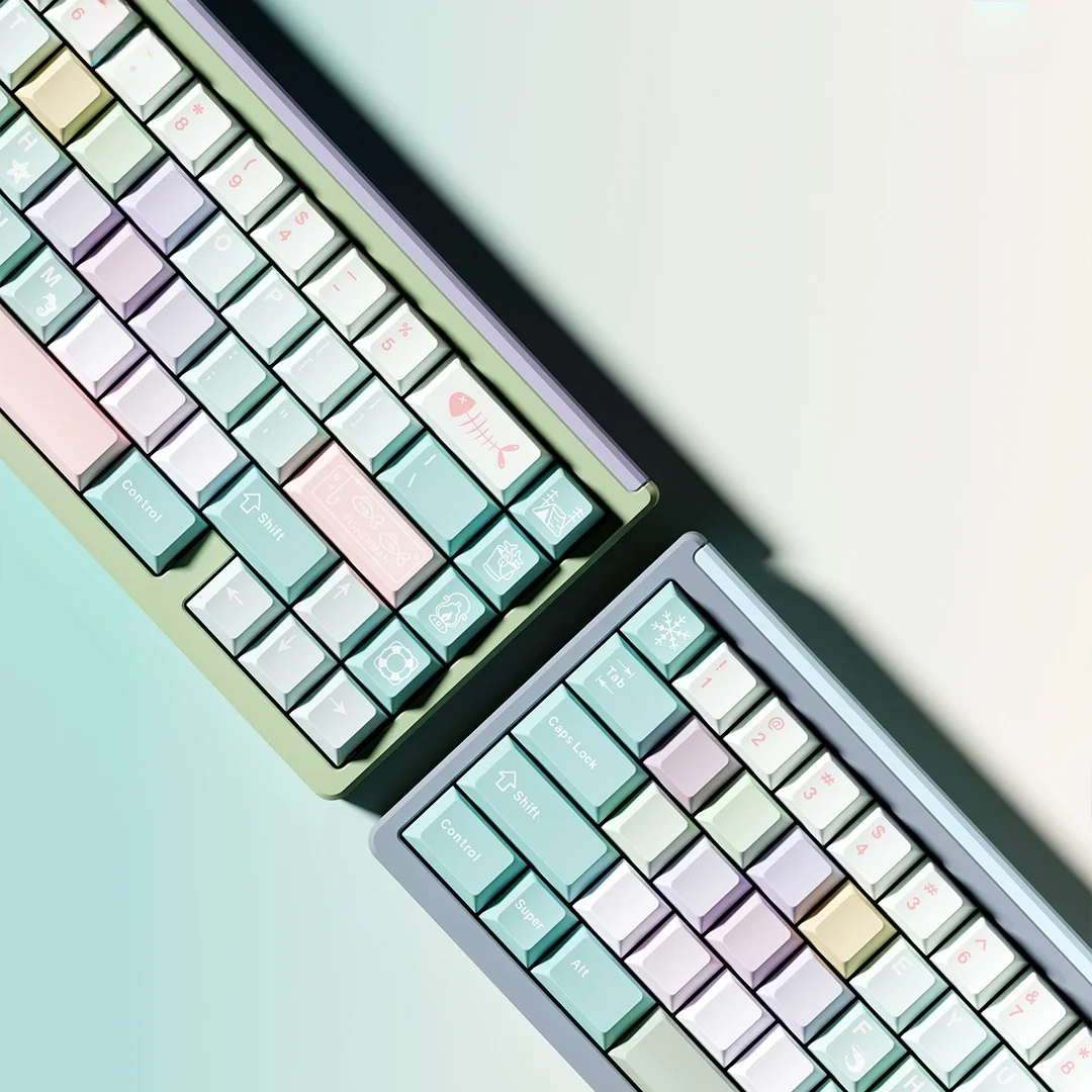 Detailed shot of Winter Angler themed keycaps, emphasizing the artistic icy blue fishing motif on individual keys.