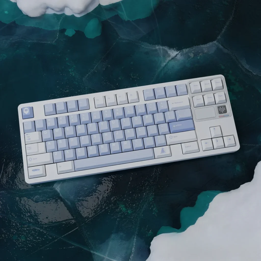 Durable PBT Winter Frost keyboard caps in frosty blue, crisp white, and cool blue, highlighting the serene winter aesthetic.