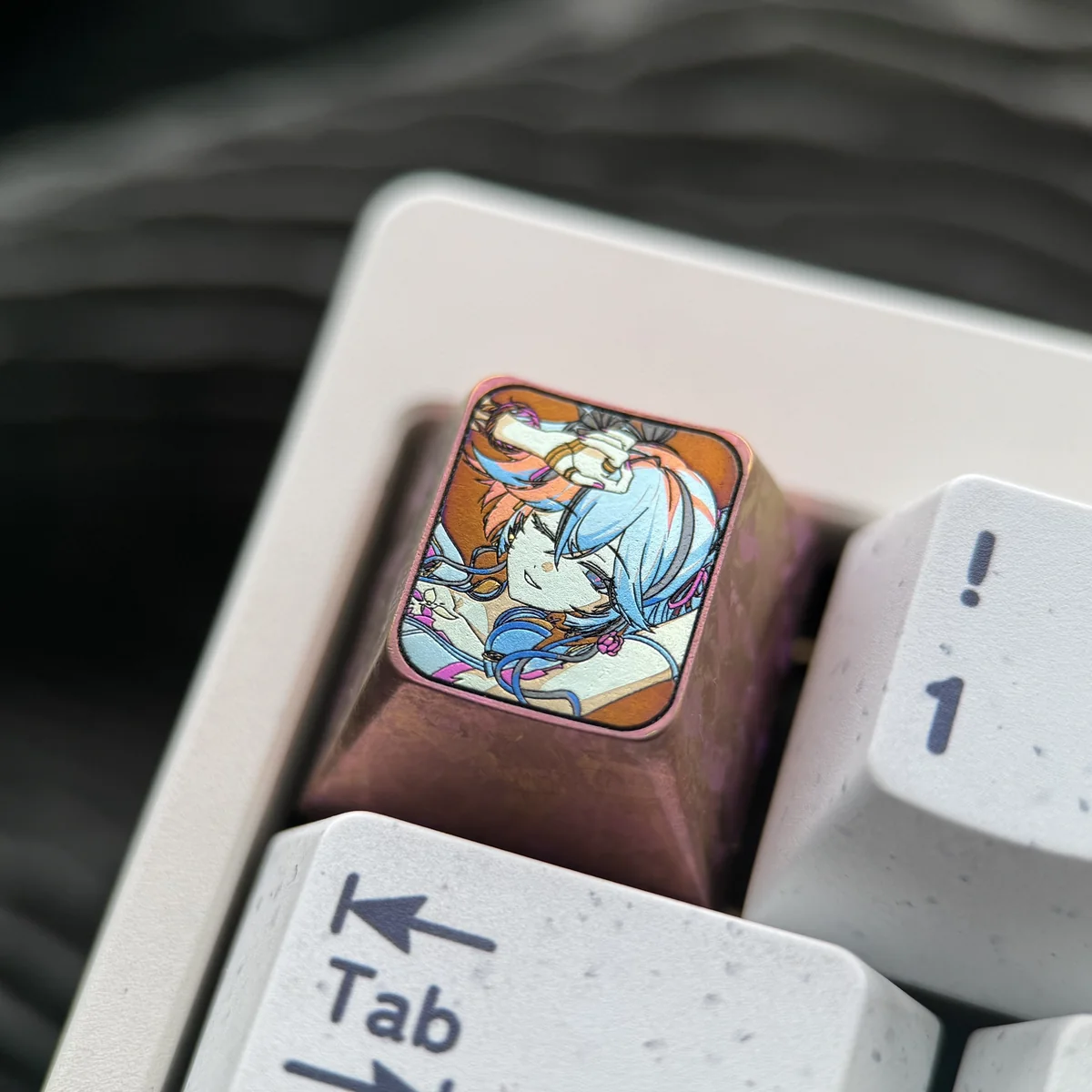 Camellya artisan gaming keycap, premium titanium, viewed from multiple angles highlighting its unique texture.