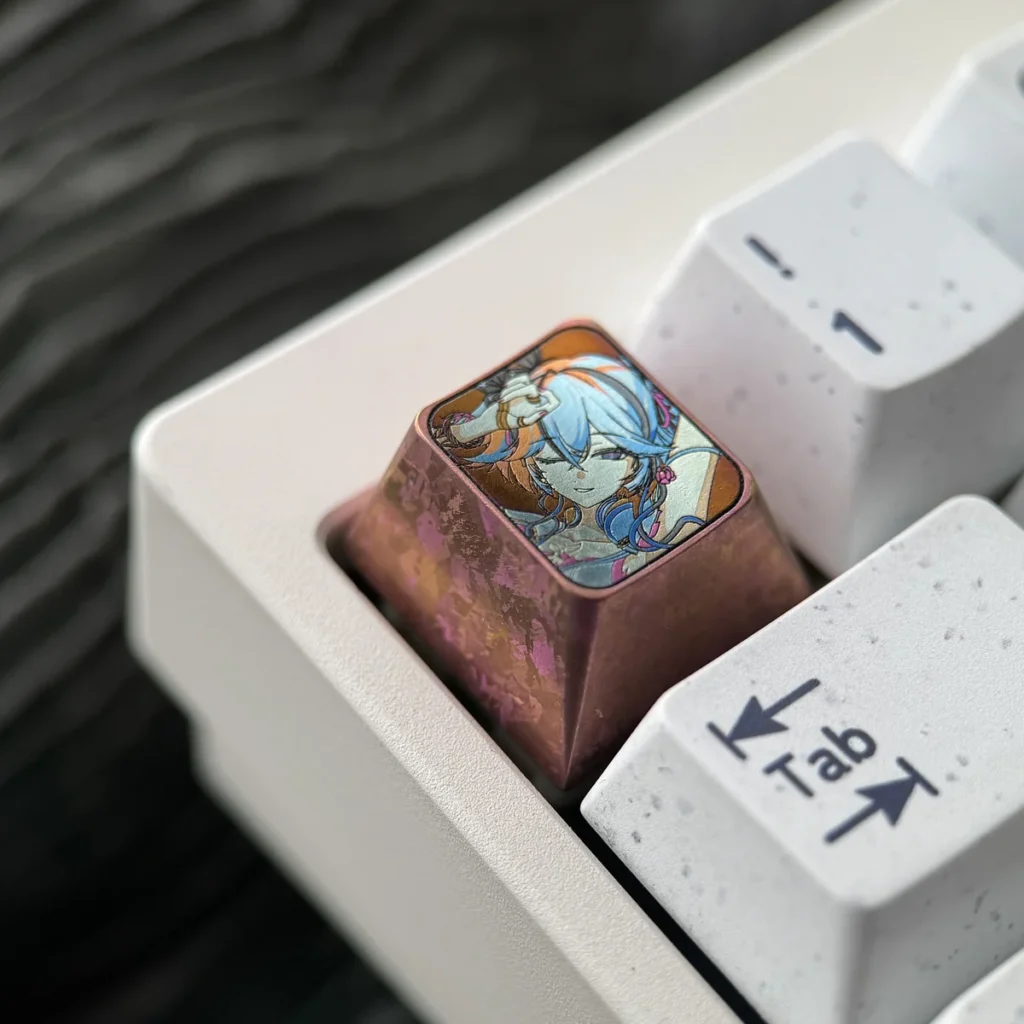 Close-up of custom titanium keyboard accent for Wuthering Waves fans, detailing craftsmanship.