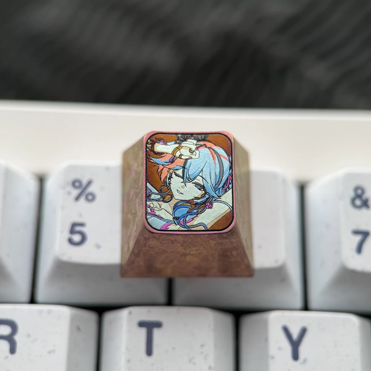 Durable Wuthering Waves keycap, pure titanium, highlighting its unique finish and resilience.