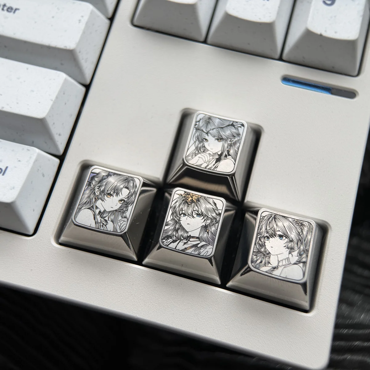 Wuthering Waves titanium keycap gallery showcasing multiple angles of precision-engraved character art with vibrant details on sleek metallic.