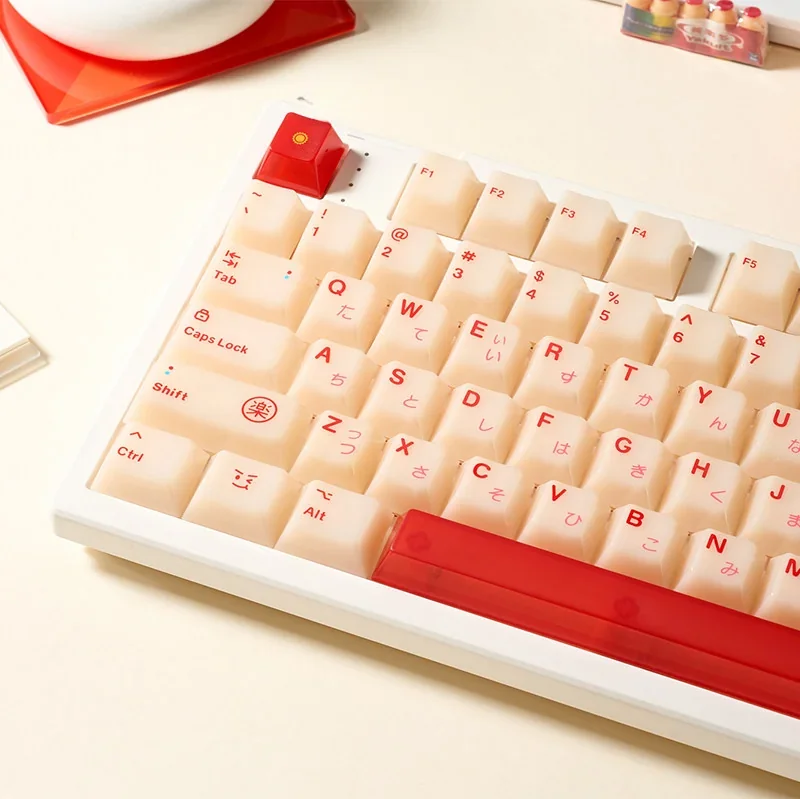 Gallery views of the playful Yakult artisan keycap set, showing its whimsical warm red beige bottle design from various angles. Nostalgic desk art.