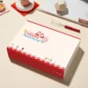 Playful Yakult artisan keycap set, nostalgic desk art, showcasing its whimsical bottle design and warm red beige tones from multiple perspectives.
