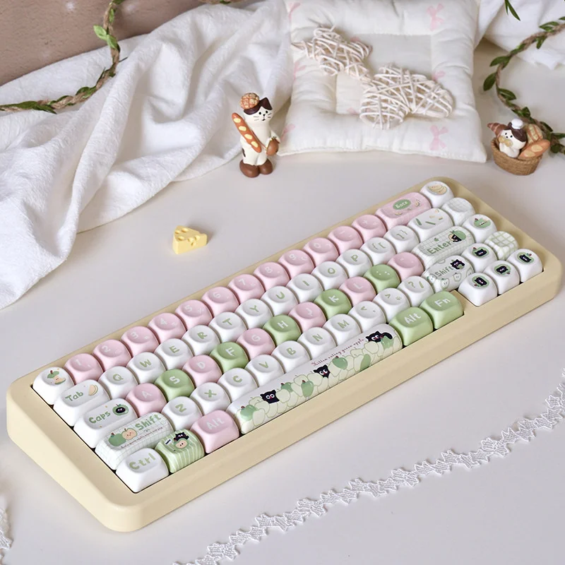 Full Apple Cat PBT Dye-Sub Keycap Set on a white mechanical keyboard, showcasing whimsical apple and cat designs.