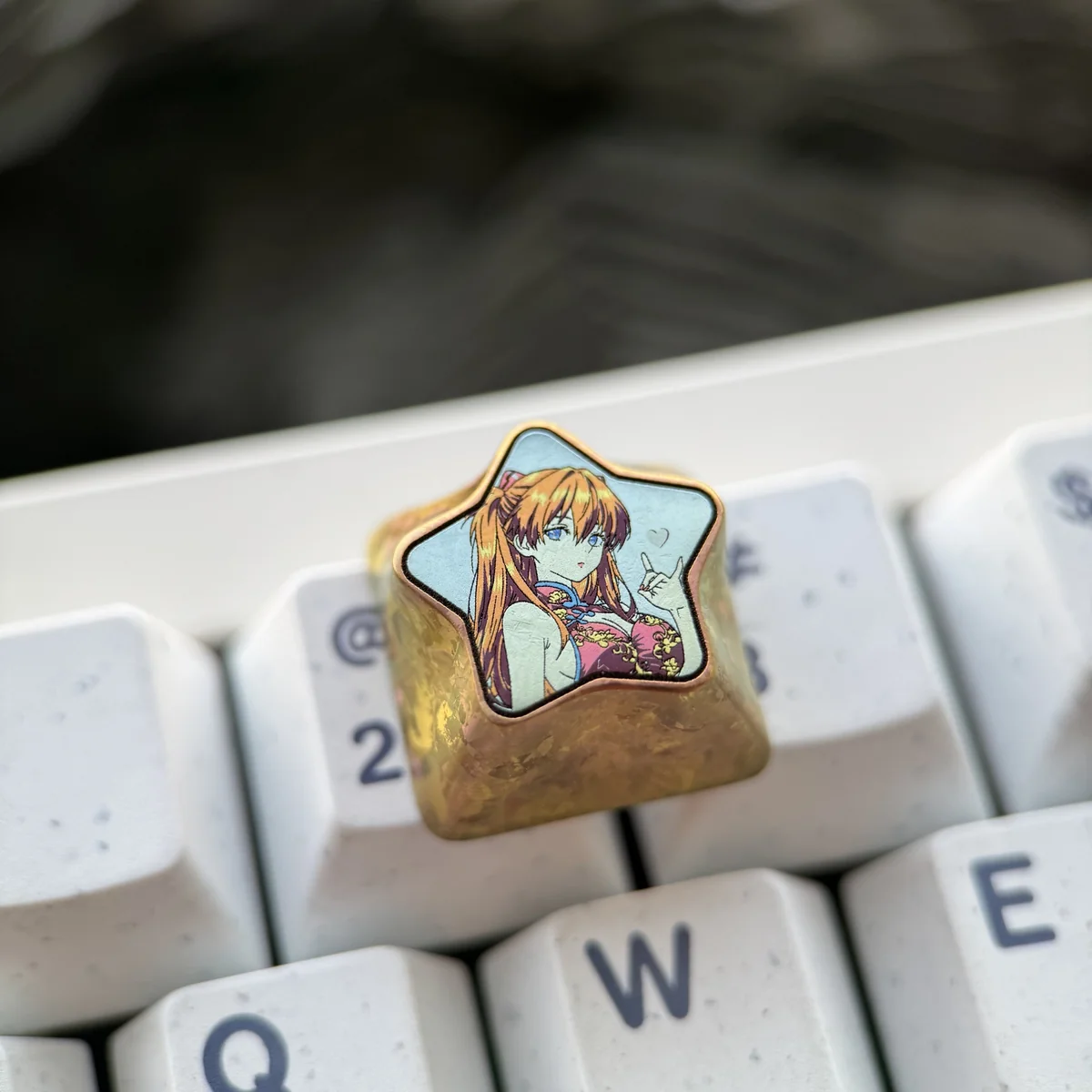 Asuka Langley Soryu titanium keycap presented in its collector's packaging