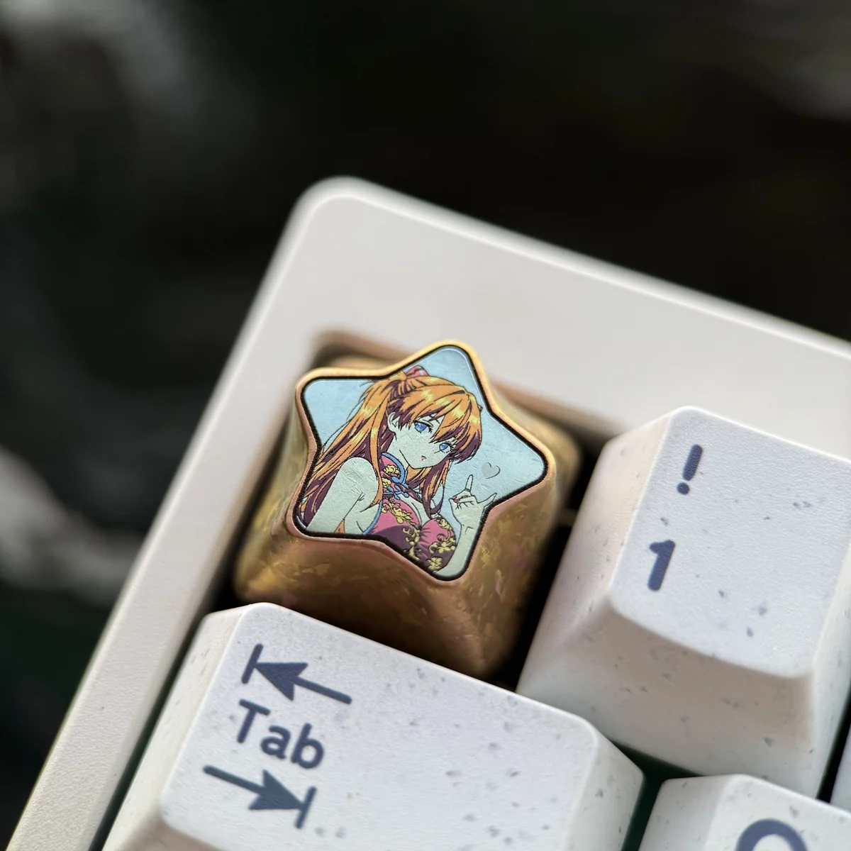 Close-up view of the intricate star design on the Asuka Langley Soryu titanium keycap