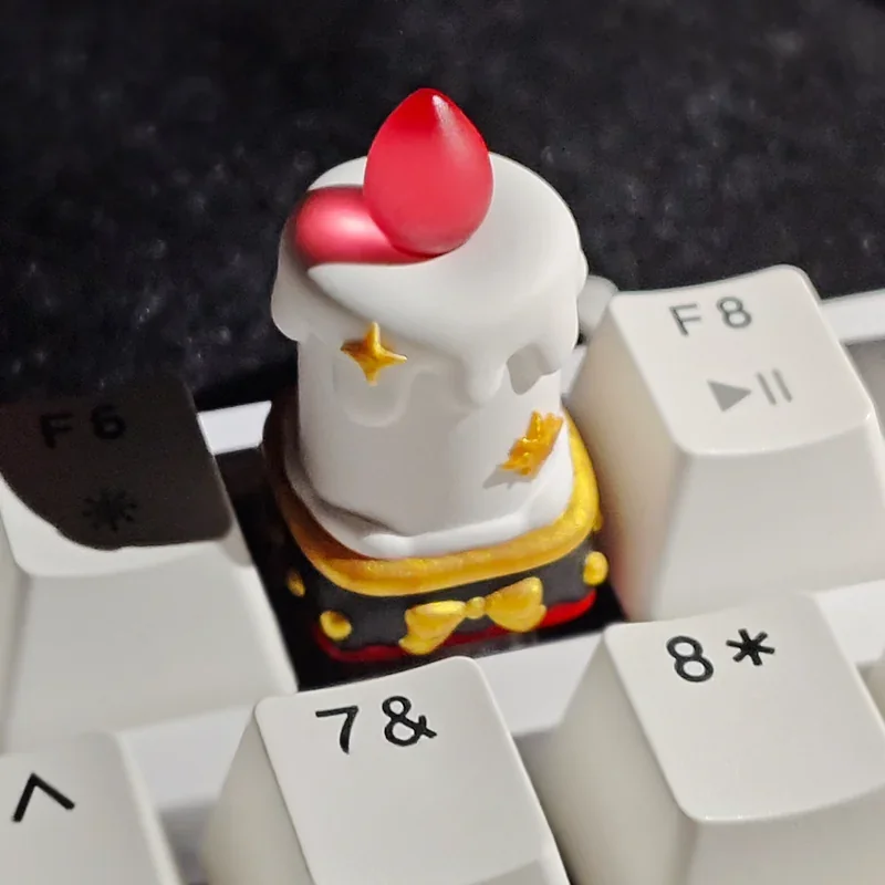 Backlit Candle Resin Keycap illuminating a keyboard setup in a dark environment