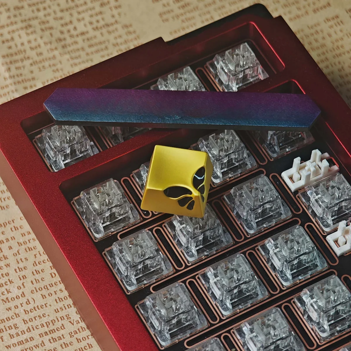 Top-down view of the metallic butterfly keycap highlighting its unique design