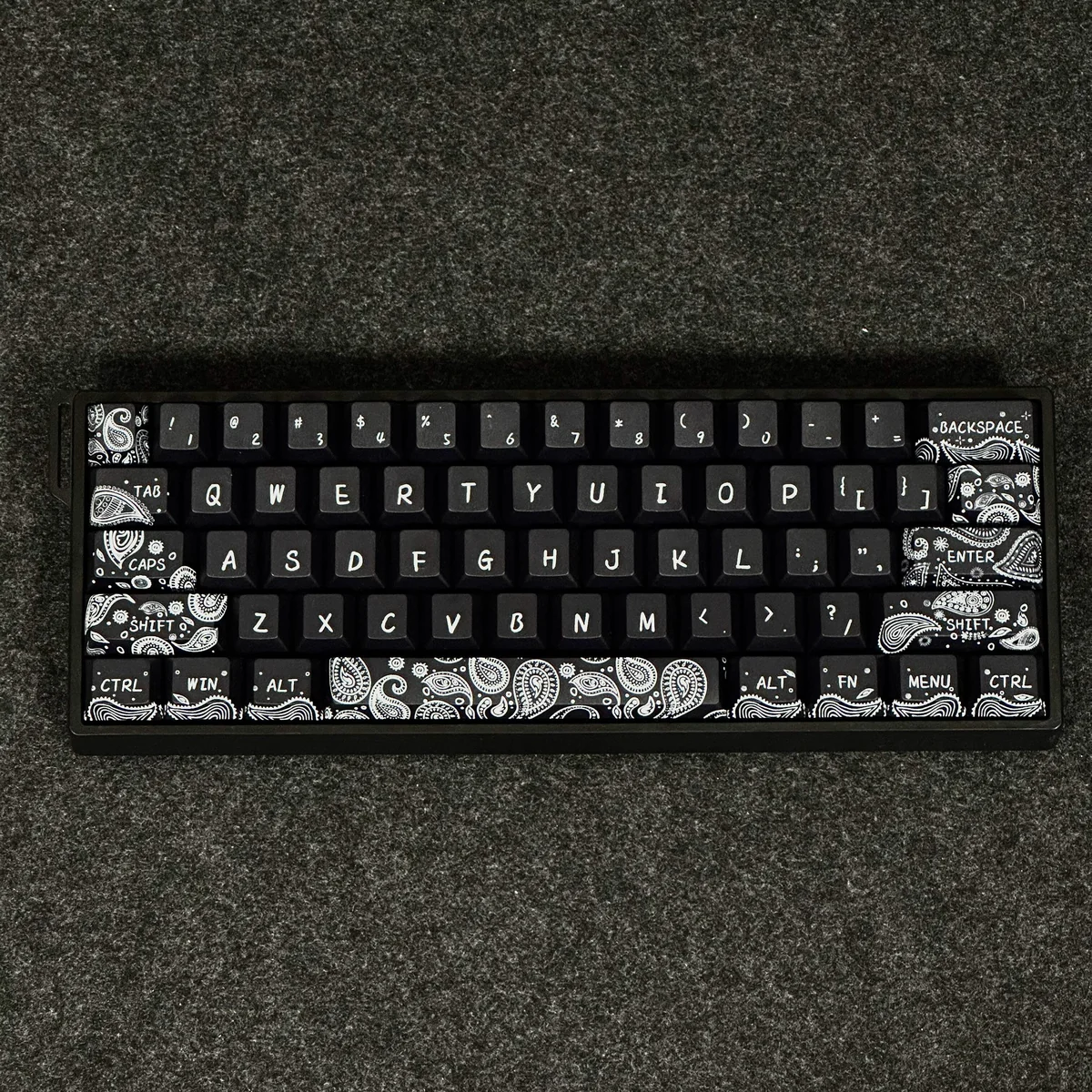 Side view of Paisley Cherry profile keycaps, illustrating their ergonomic sculpted shape.
