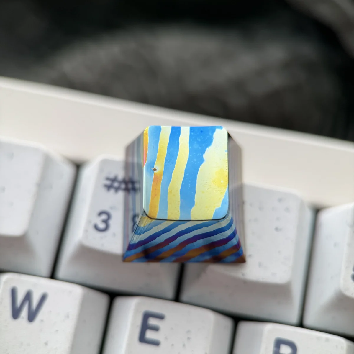 Damascus Titanium ESC keycap installed on a mechanical keyboard