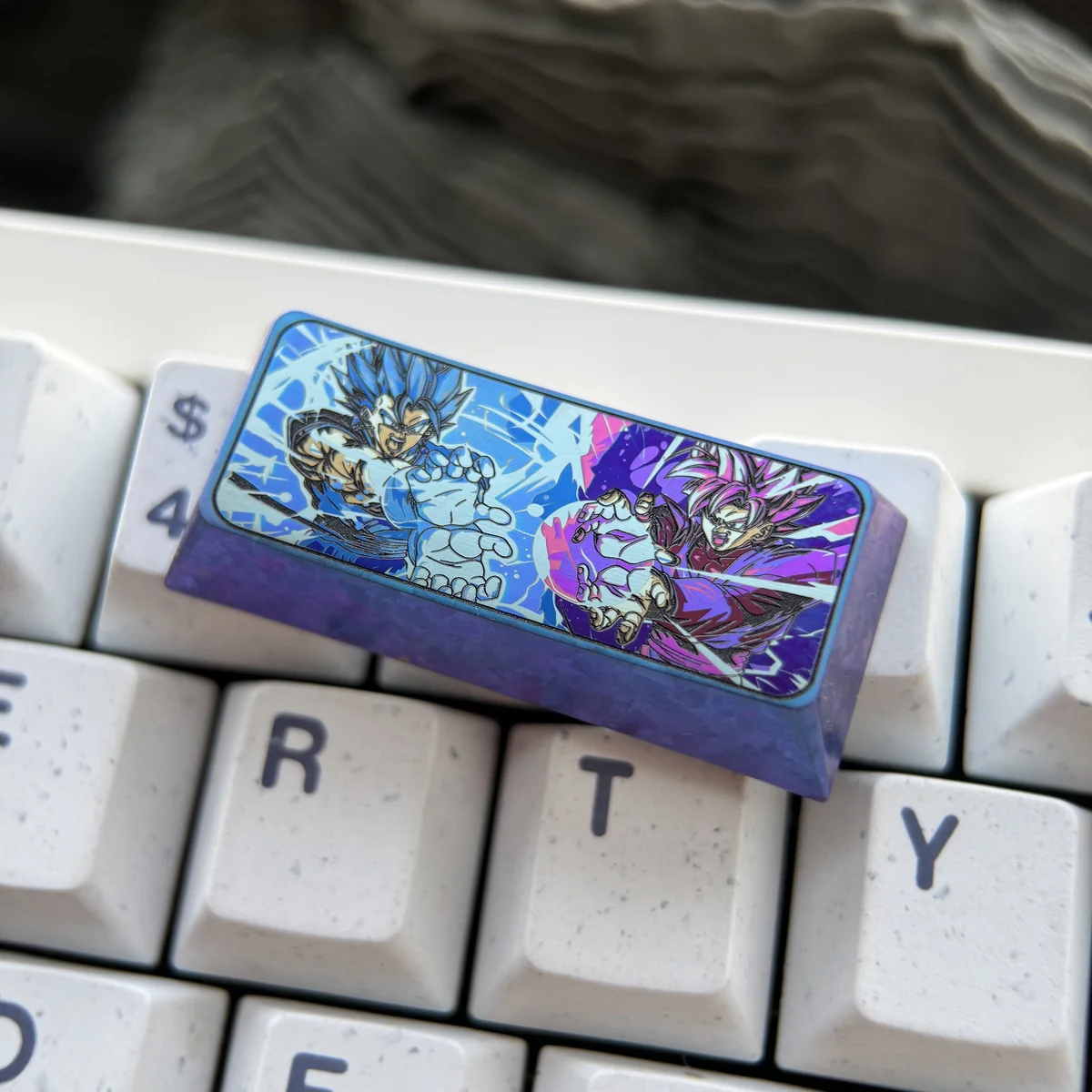 Titanium artisan keycap on a mechanical keyboard