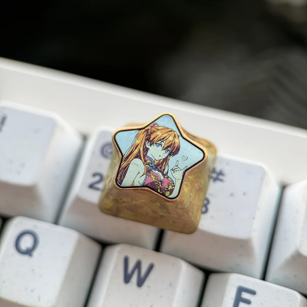 Collection of Evangelion-themed artisan keycaps, including Asuka, Rei, and EVA Unit-01 designs