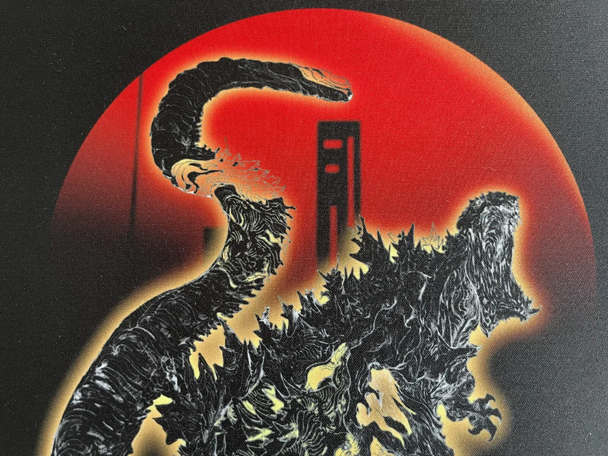 Close-up of the detailed original Godzilla artwork on the mouse pad
