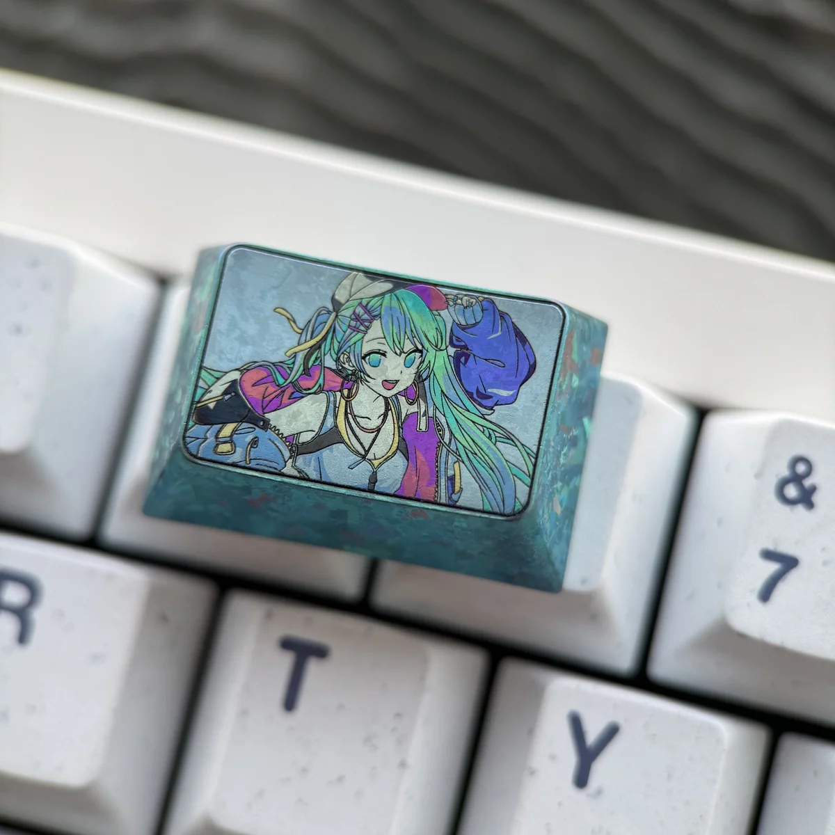 Hatsune Miku artisan keycap with other themed keycaps