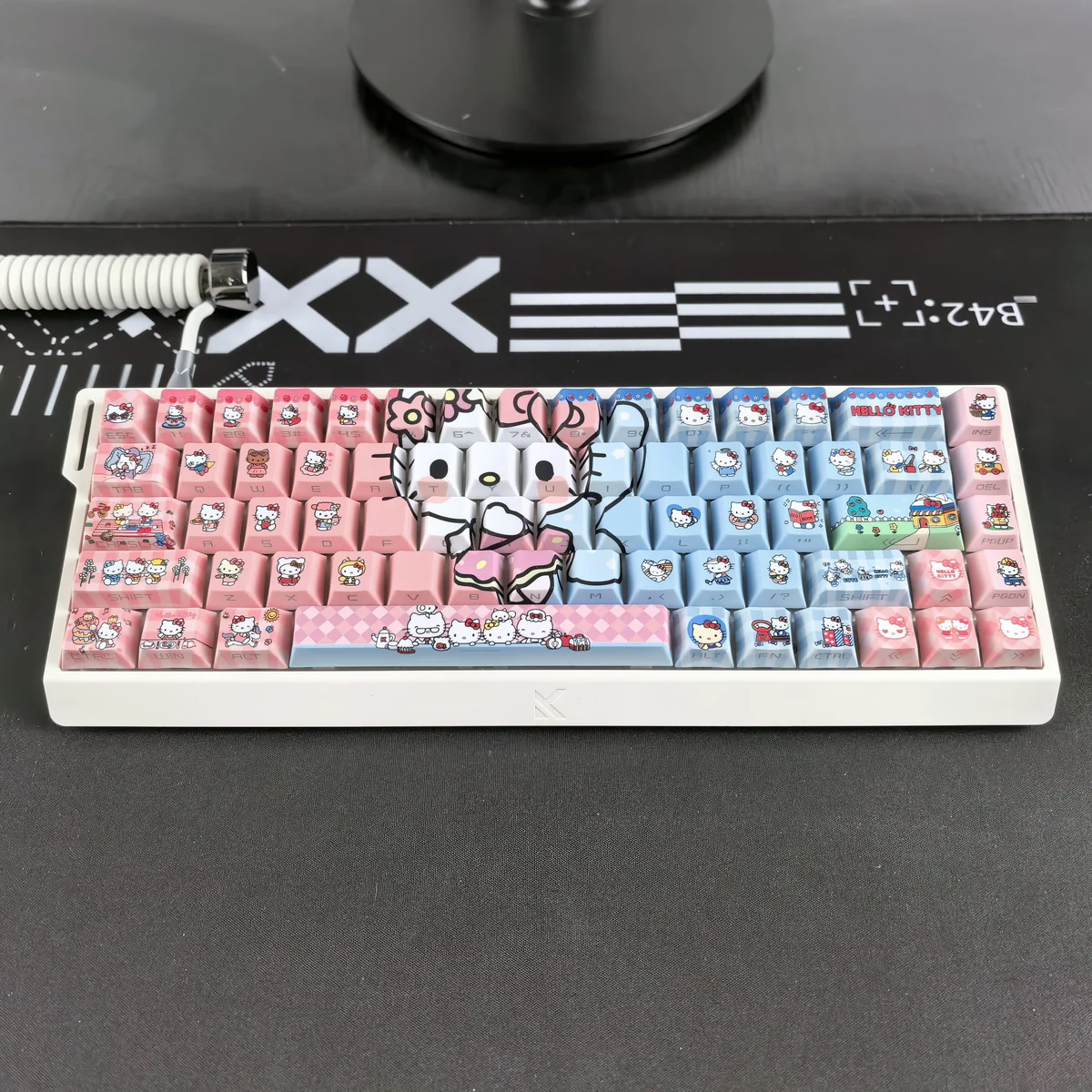 Close-up of Hello Kitty keycaps showcasing translucent PBT and side-engraved legends