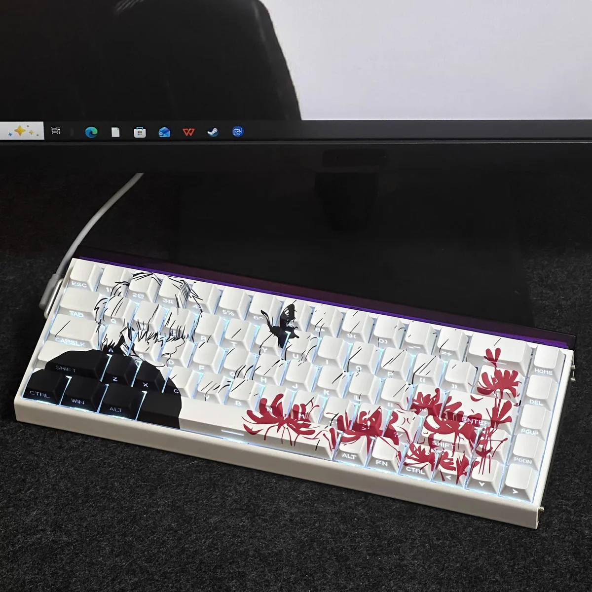 Close-up of Ken Kaneki keycaps showing detailed side-engraved legends