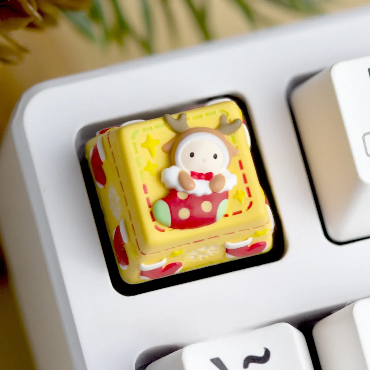 Detailed view of miniature holiday sculpture on ESC key