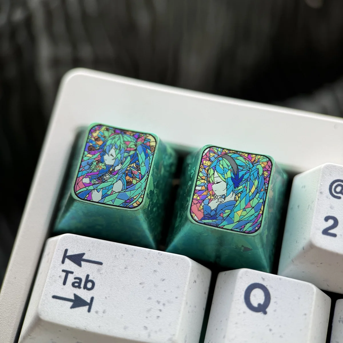 Side view of Hatsune Miku keycap highlighting its profile and premium titanium craftsmanship