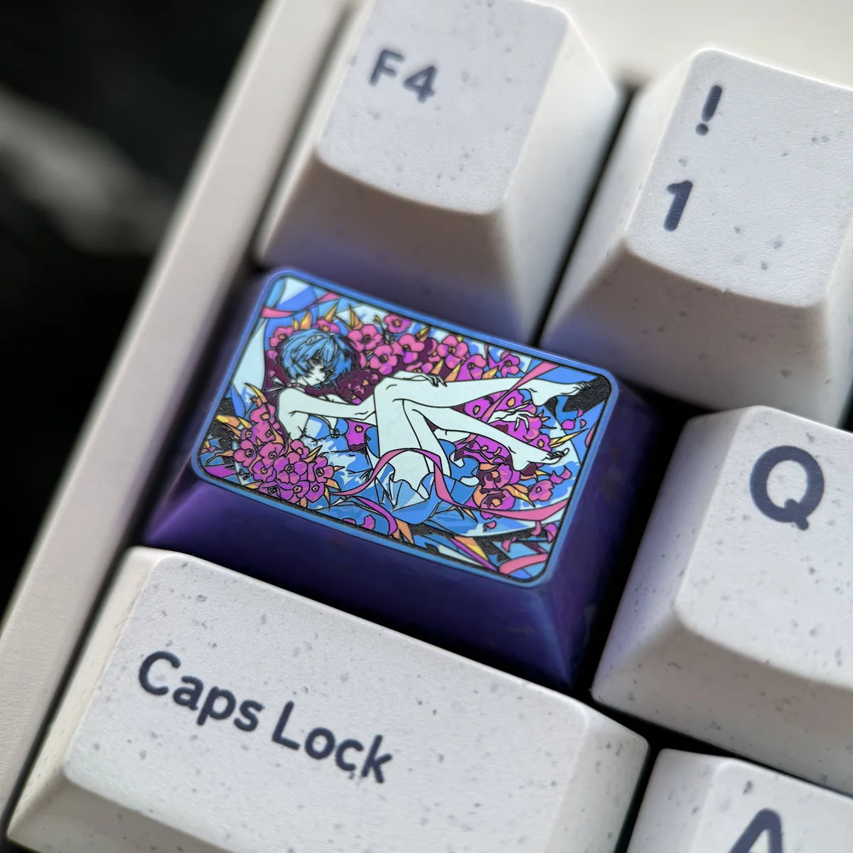 Side view of Rei Ayanami keycap showing titanium finish