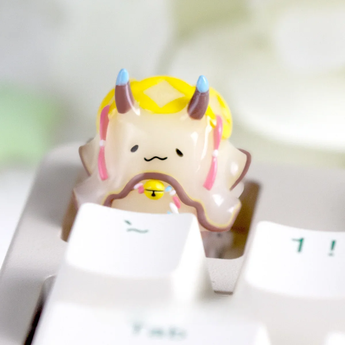 Desk setup featuring the unique Sea Hare artisan keycap alongside other custom keyboard accessories