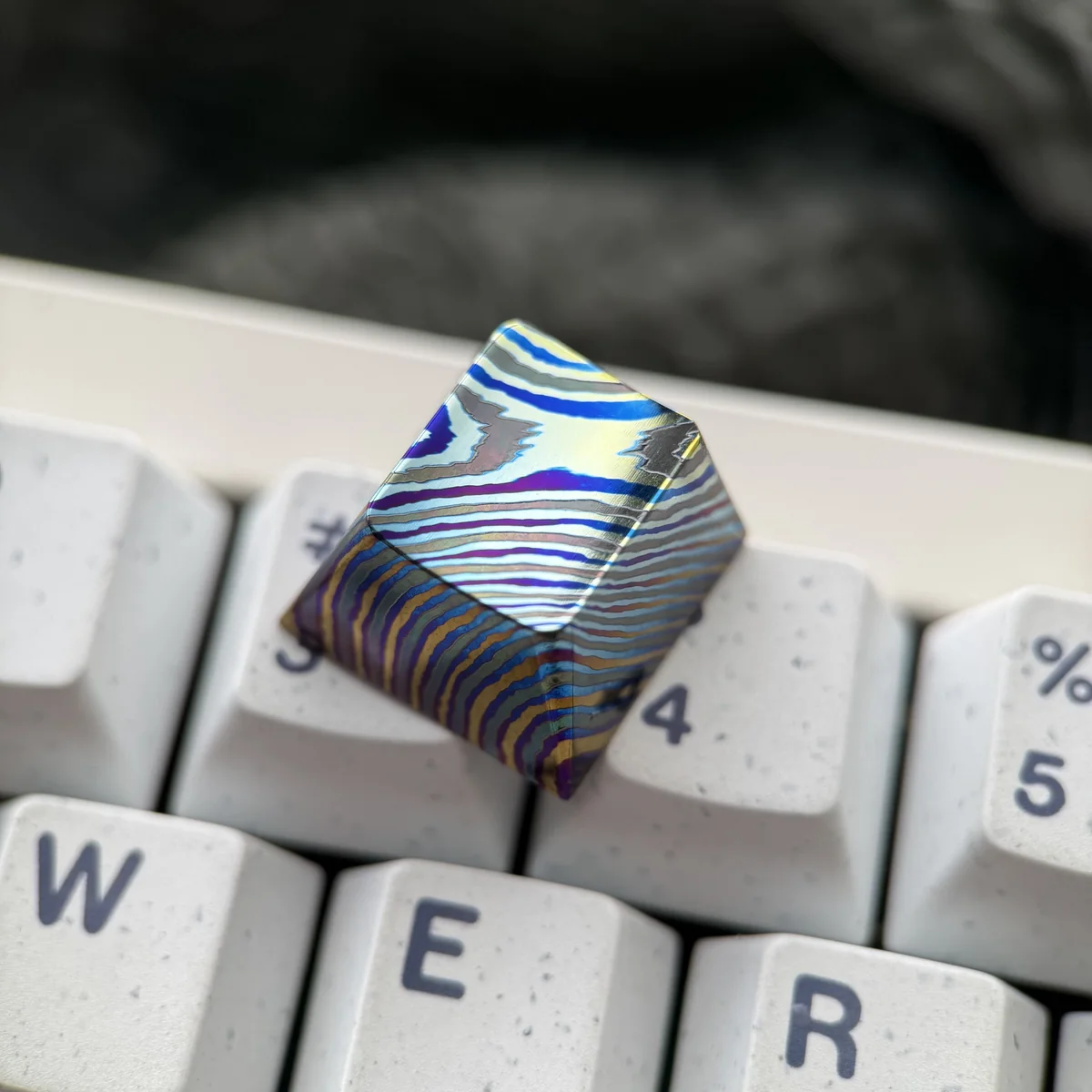 Side view of the robust titanium construction of the artisan keycap