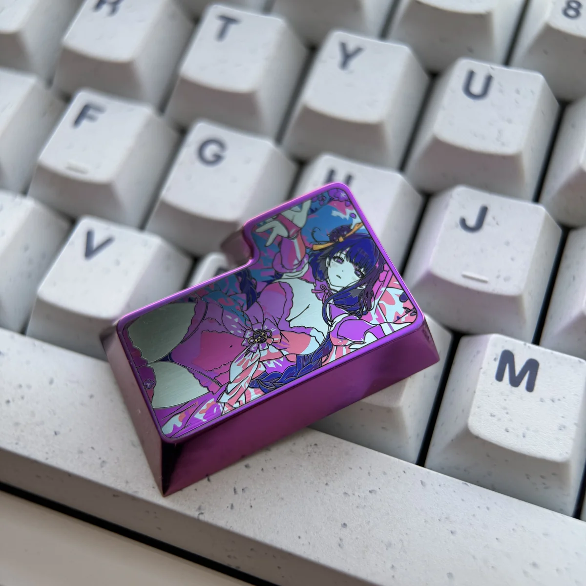 Side profile of the titanium Raiden Shogun keycap showing its finish