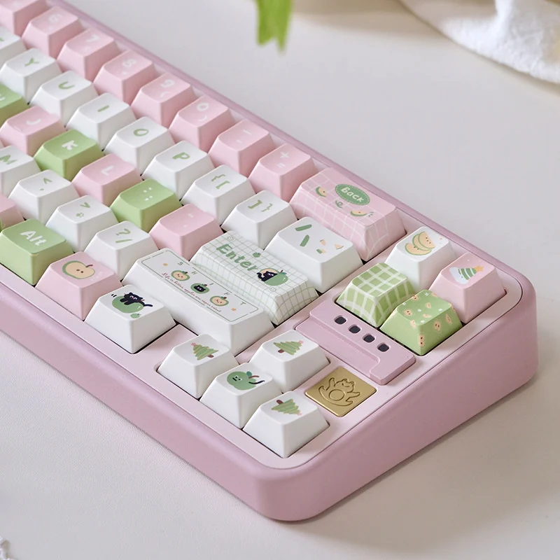 Apple Cat themed keycaps arranged artfully, emphasizing the cute character motifs and soft color palette.