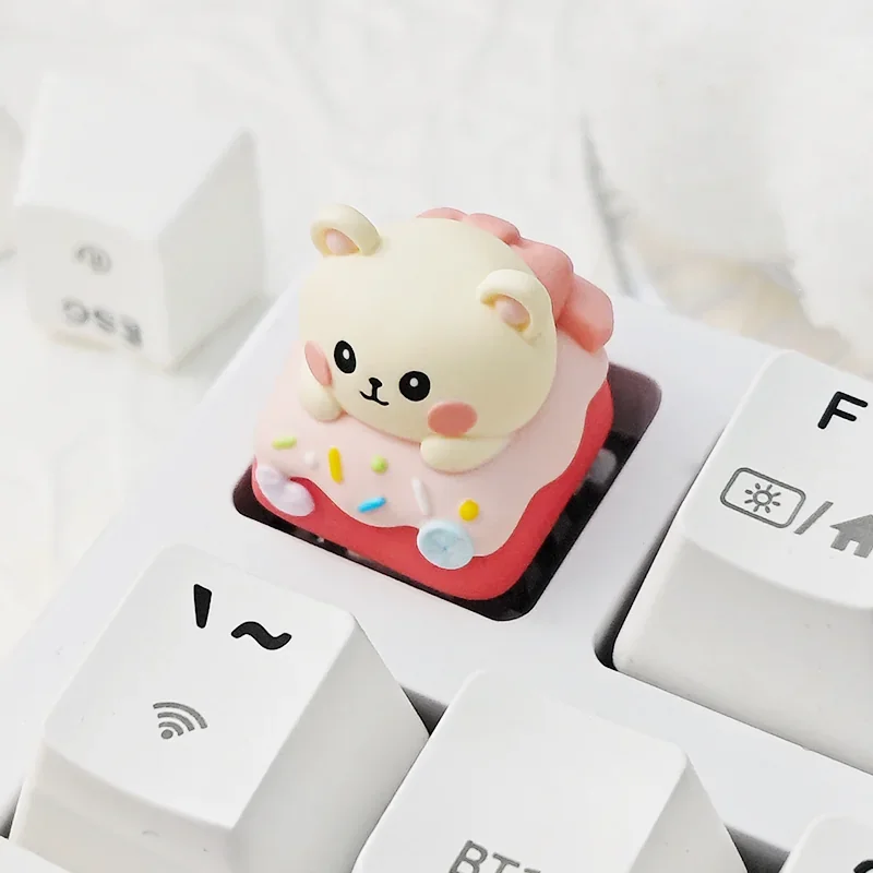 Whimsical miniature candy house scene within the translucent resin of the Candy Mouse artisan keycap