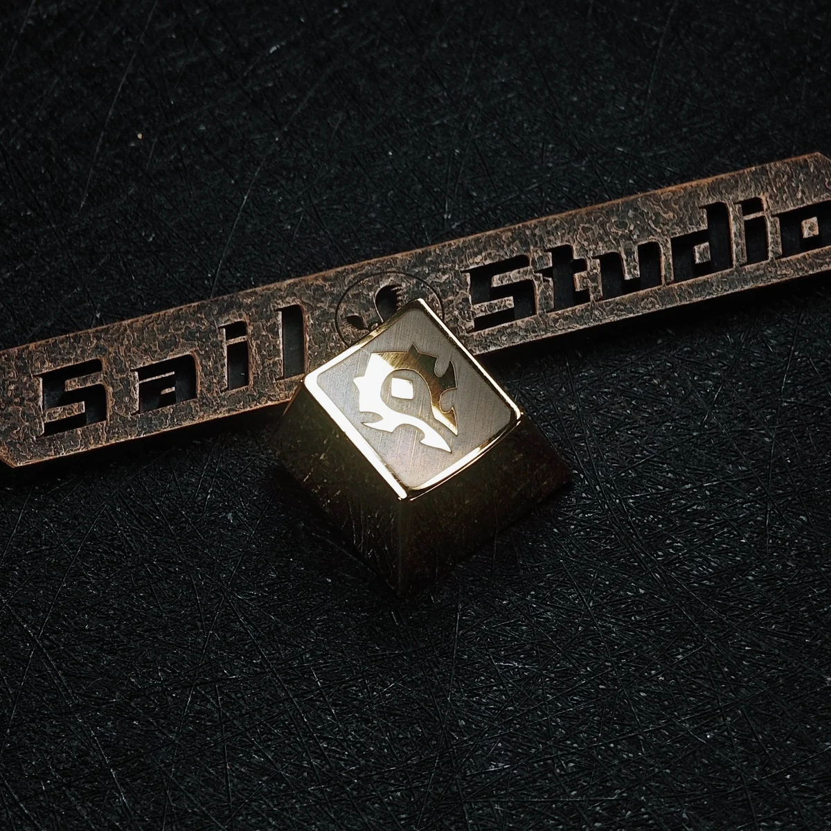 Gaming setup featuring a WoW metal keycap with RGB lighting