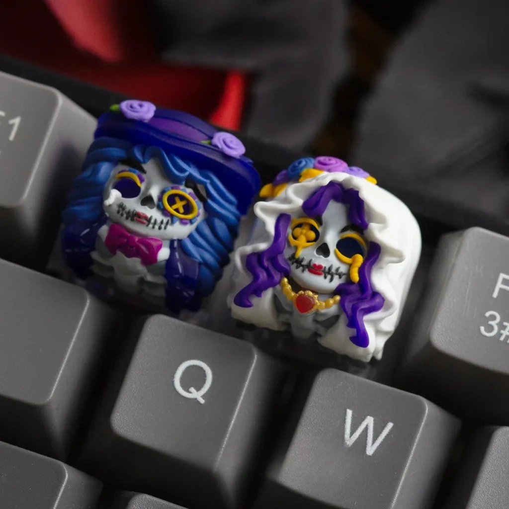Zombie Bride and Groom Artisan Keycaps set on a mechanical keyboard, showing translucent resin detail.