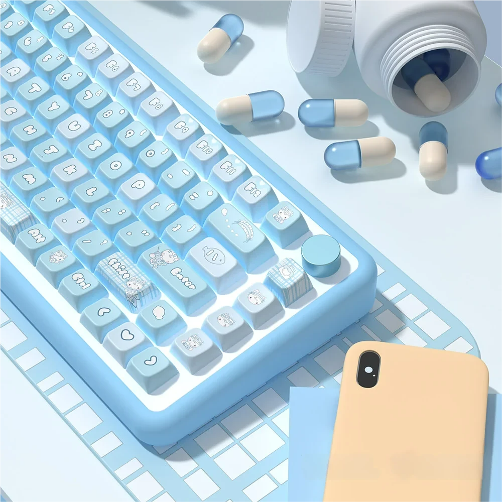 Detailed shot of individual Aqua Kitten keycaps, focusing on the unique character designs and vibrant aqua hues.