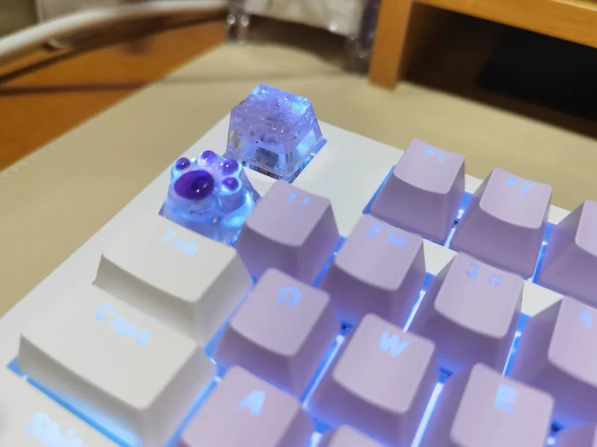 Hand holding a Crushed Ice Keycap, showcasing its artisanal craftsmanship and unique design.