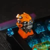 Close-up of backlit Bumblebee resin keycap with RGB lighting