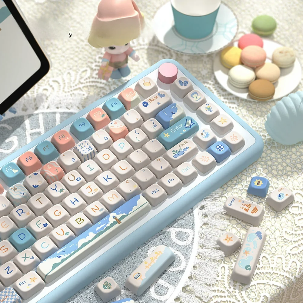 Close-up of Beach Summer keycaps highlighting the dye-sublimated beach and wave art on PBT material