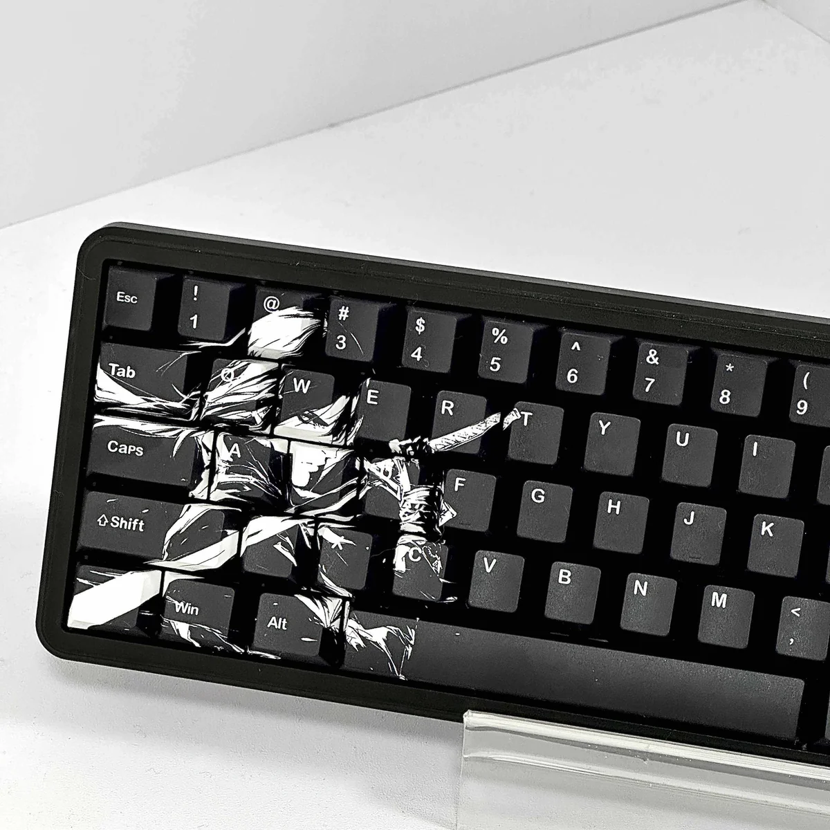 Close-up of Black Blade keycap with intricate character design