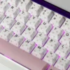 Butterfly & Heart-Shaped Cherry Charming installed on a mechanical keyboard setup